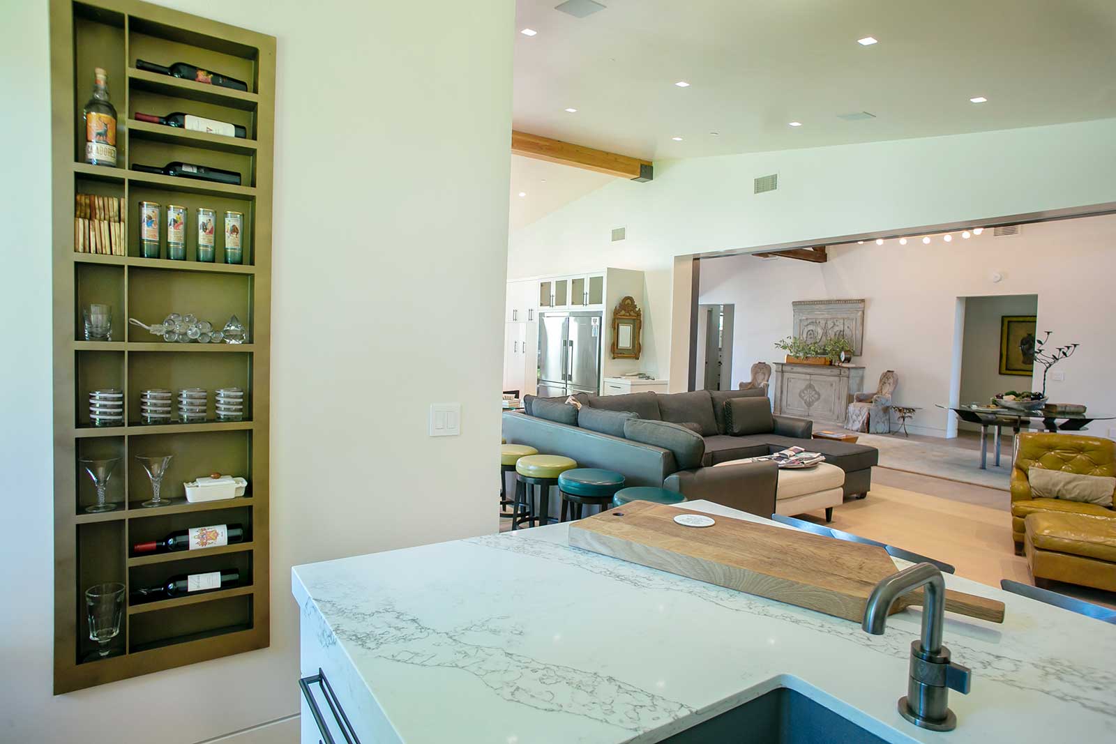 Recessed metal shelving set into a finished wall